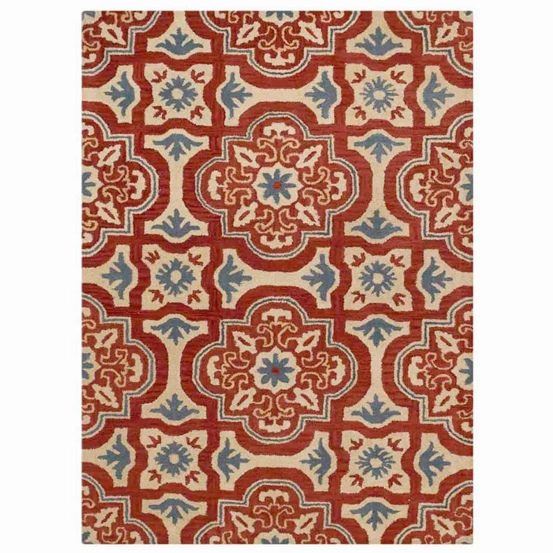 Floral patterned area rug with central medallion in red, blue, and cream