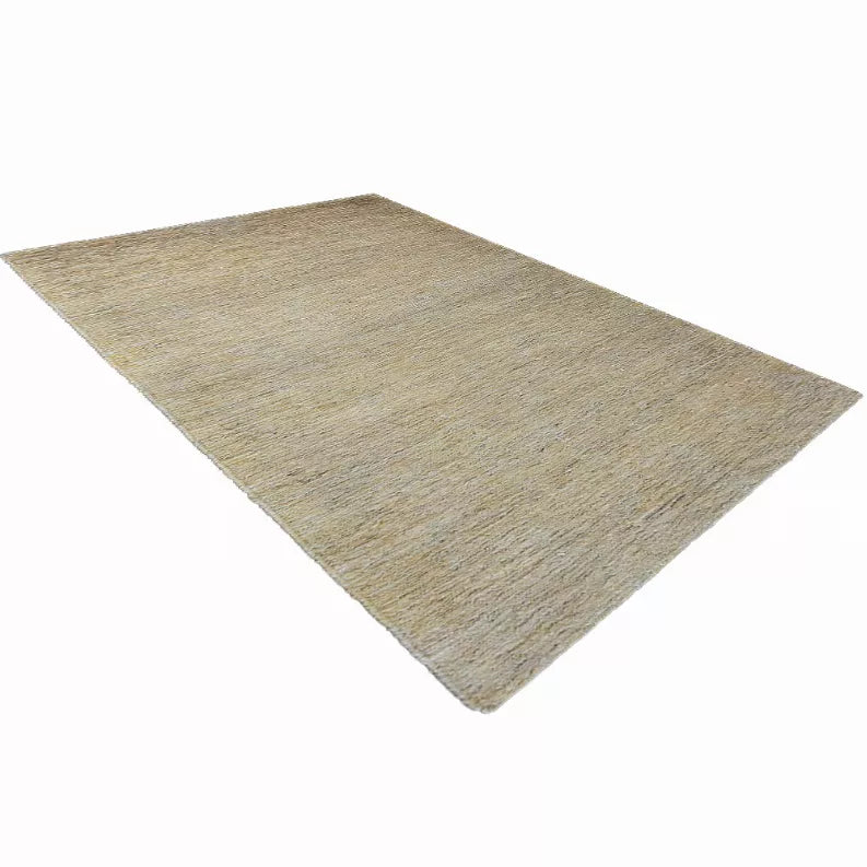 Beige hand-woven jute area rug with solid textured surface, angled view