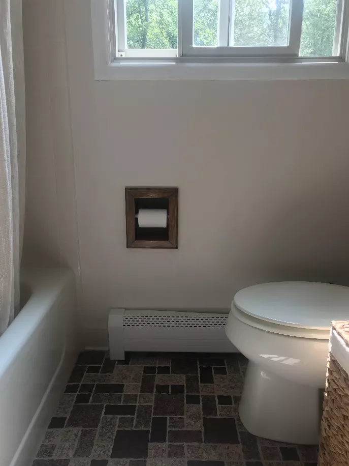 Recessed wood toilet paper holder mounted on bathroom wall, no roll visible