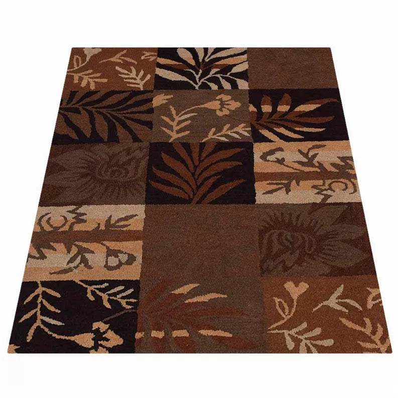 Patchwork floral area rug with square blocks in brown, tan, and dark brown tones