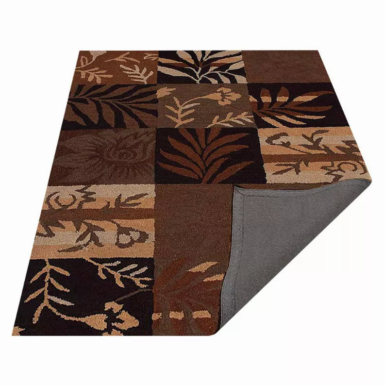 Patchwork squares area rug with leaf and floral pattern in dark brown and tan