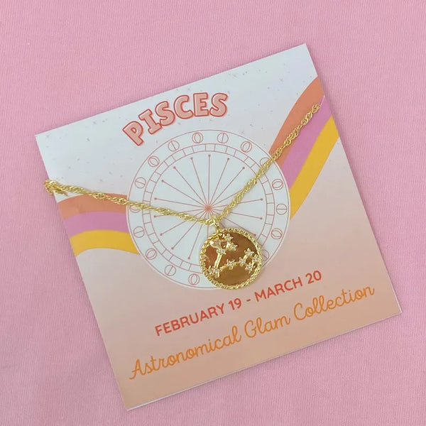 Pisces zodiac pendant necklace with gold chain and round starry charm on card