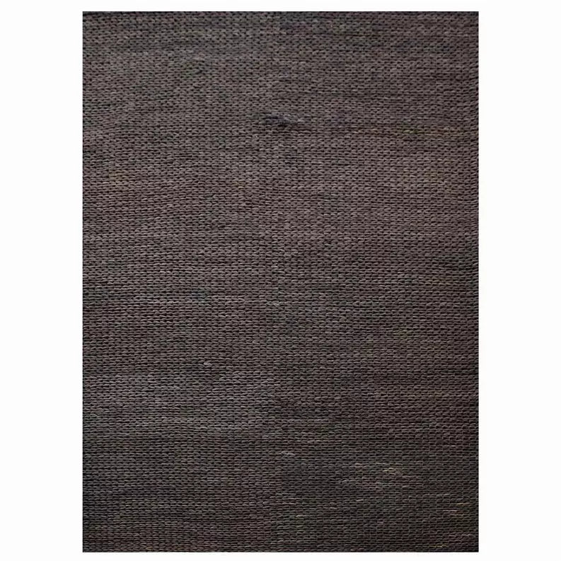 Hand-woven jute area rug, solid dark charcoal brown with tight woven surface texture