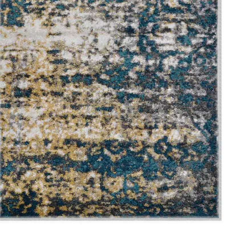 Detail of abstract rug with teal and blue medallion shapes on gray and beige background