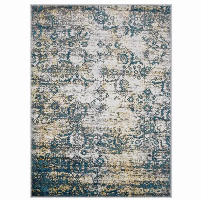 Front view of abstract area rug with distressed damask-like pattern in teal and blue