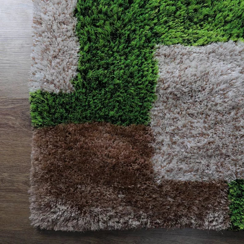 Square shag rug with geometric blocks in green, gray, brown, and black.