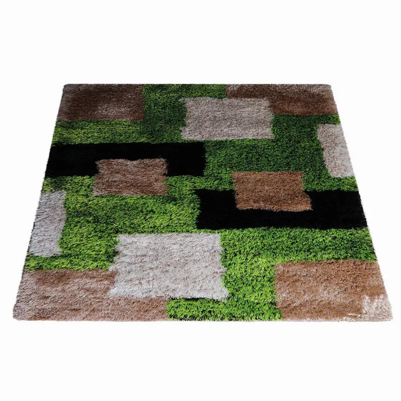 Square geometric shag area rug with green, gray, brown, black, and white blocks.