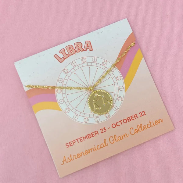 Libra zodiac pendant necklace with gold chain on product card