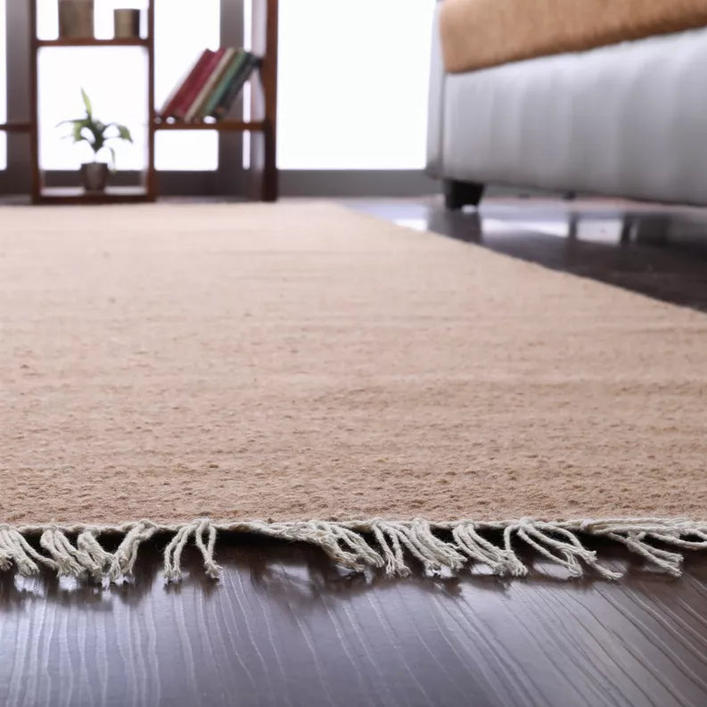 Tan flatweave Kilim wool area rug with short fringed edge