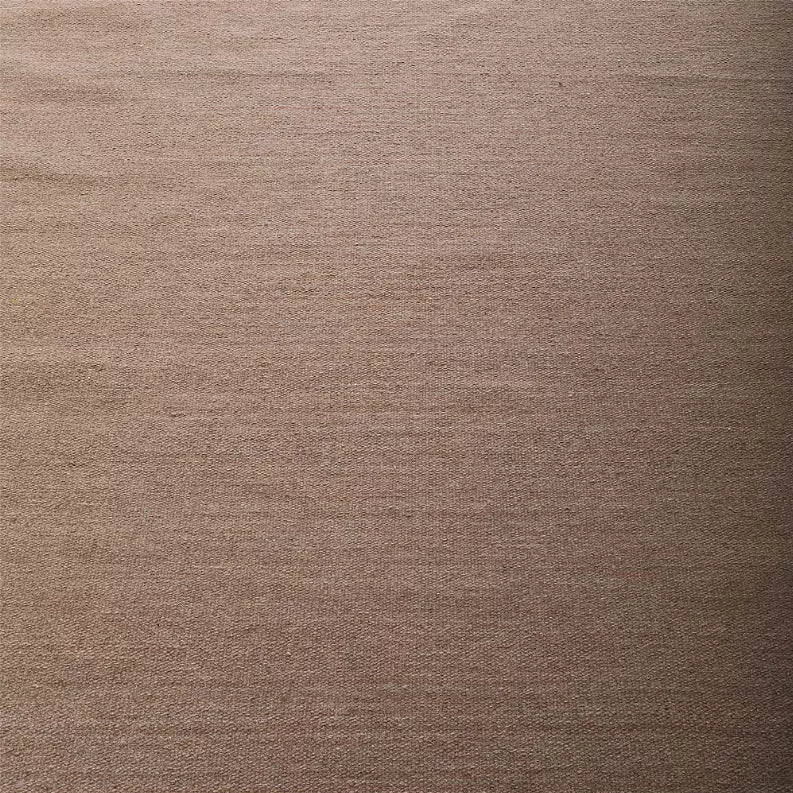 Tan flatweave Kilim wool area rug surface with fine woven texture