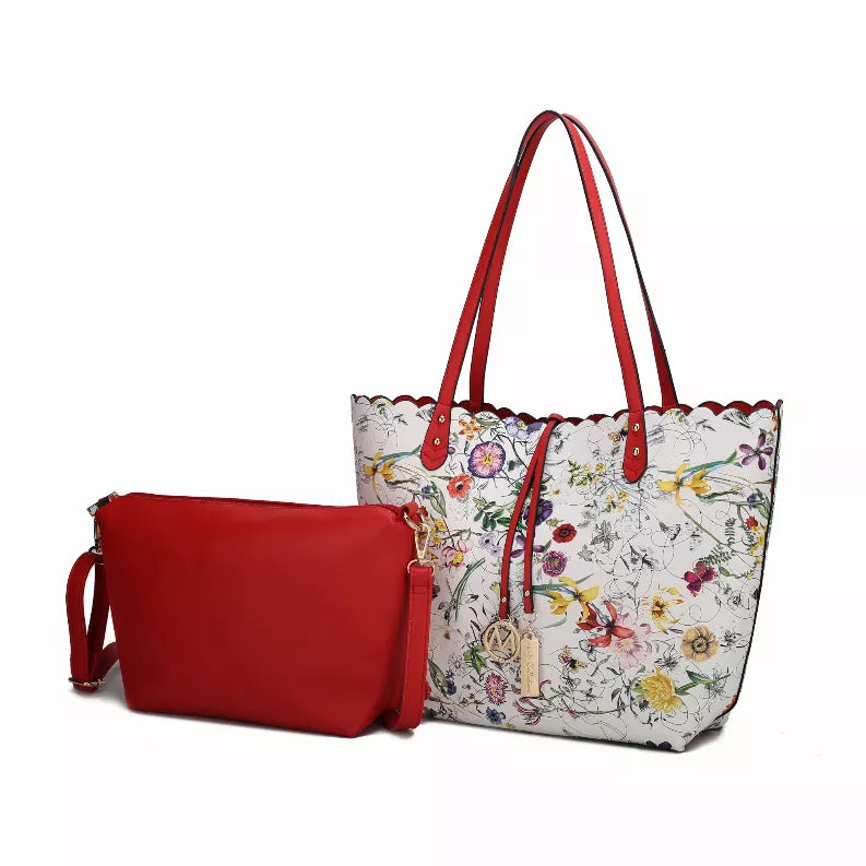 Reversible shopper tote bag with white floral print, red handles, and red zip pouch