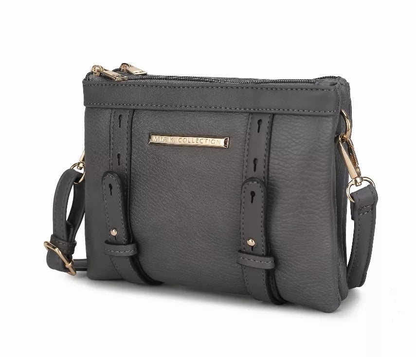 Dark gray multi-compartment crossbody bag with zip top, front patch, and adjustable straps