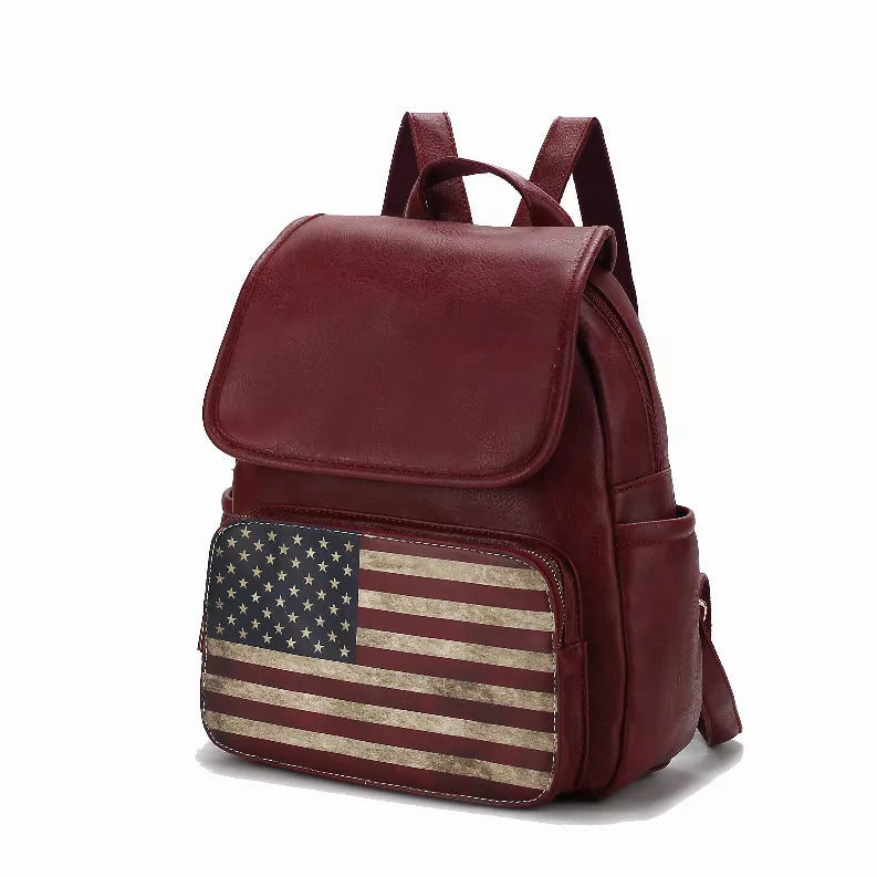 Women's maroon vegan leather backpack with top flap, U.S. flag front pocket, shoulder straps