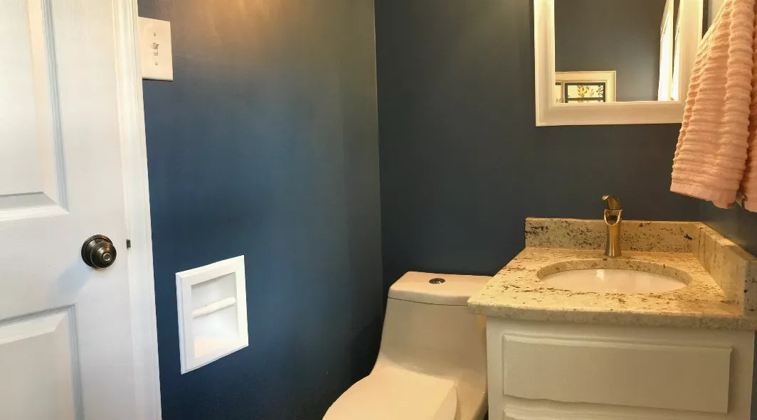 Recessed solid wood toilet paper holder with toilet paper roll, mounted in wall