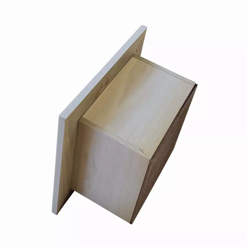 Natural wood recessed toilet paper holder with white roll displayed in square frame