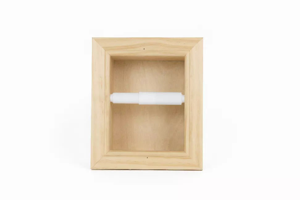 Recessed solid wood toilet paper holder with a white paper roll inside