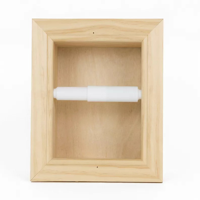 Recessed solid wood toilet paper holder with white roll centered in frame
