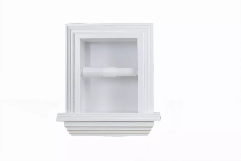 White recessed toilet paper holder with decorative trim, holding a toilet paper roll