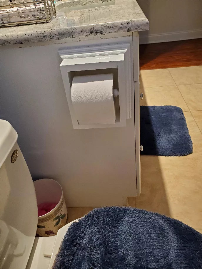 Recessed wood toilet paper holder with square opening holding a roll