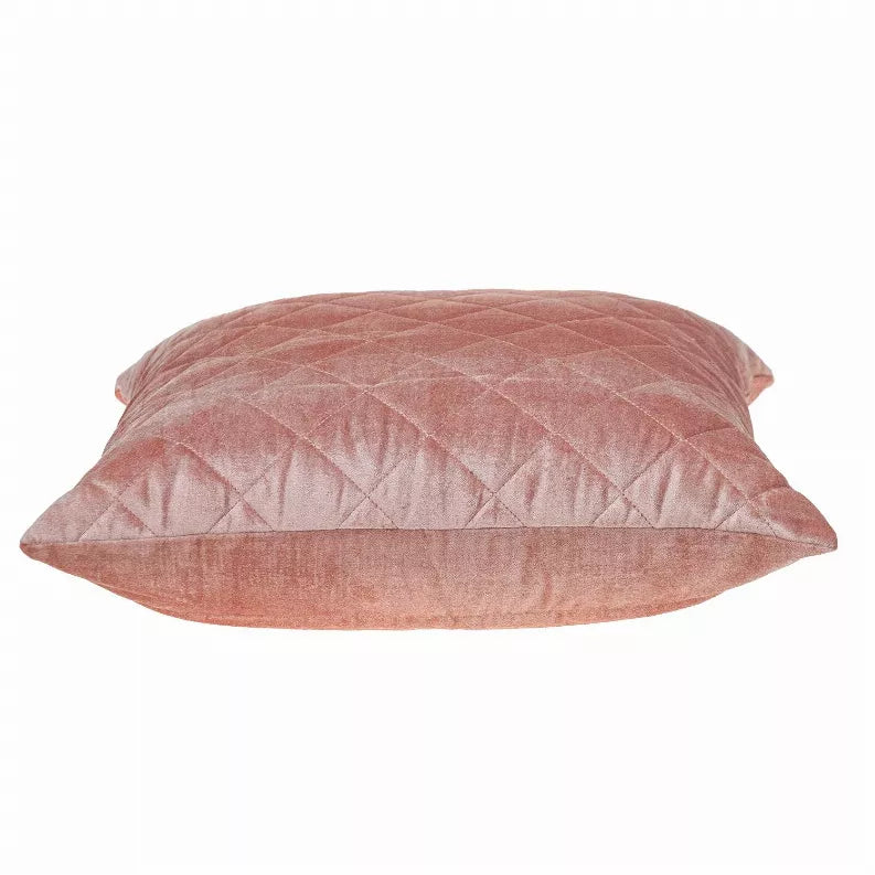Quilted throw pillow in dusty rose pink with diamond pattern on top and sides