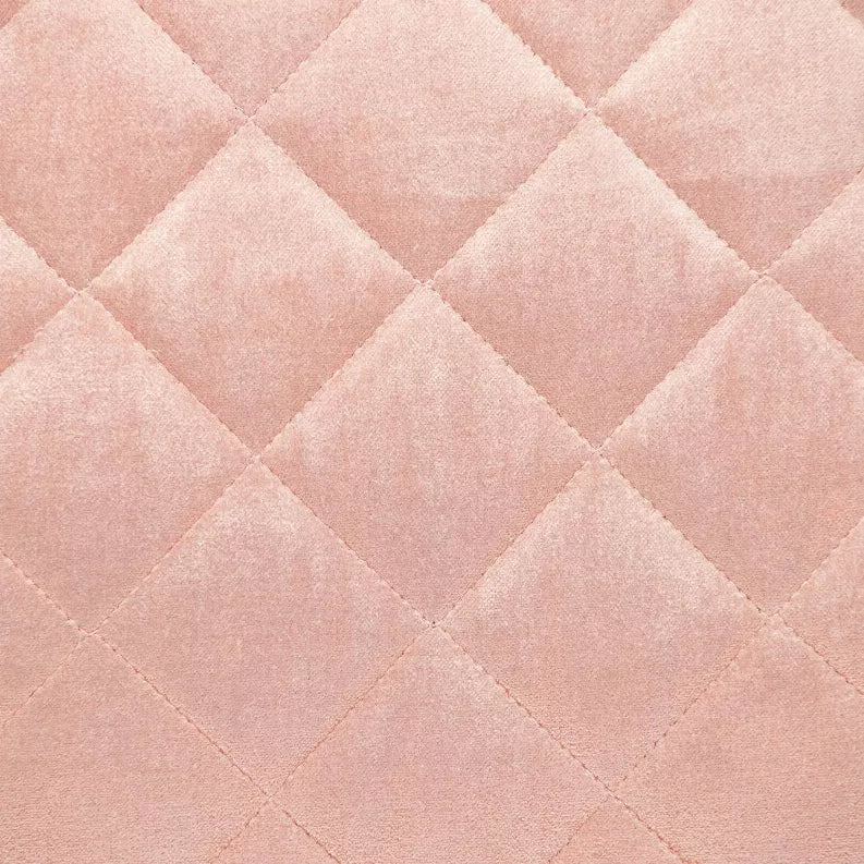 Close-up of dusty rose diamond-quilt stitching on a throw pillow cover