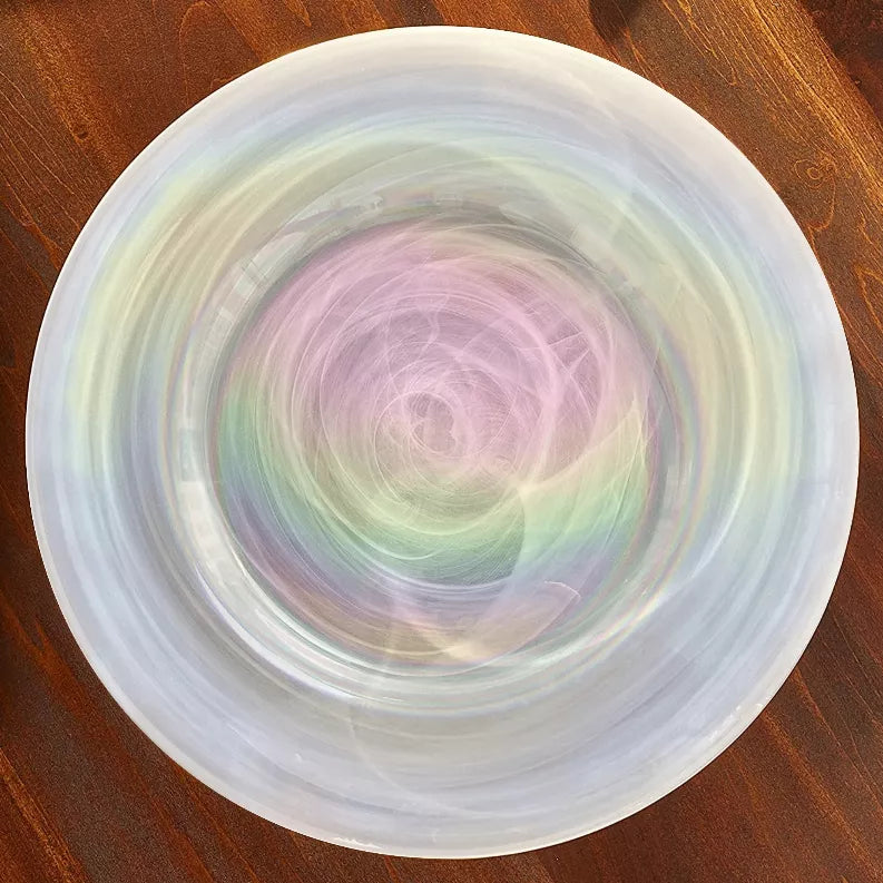 13-inch glass charger plate with pink, green, and yellow iridescent swirl pattern