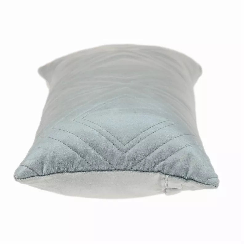 Light gray-blue quilted throw pillow with raised diamond and chevron stitches