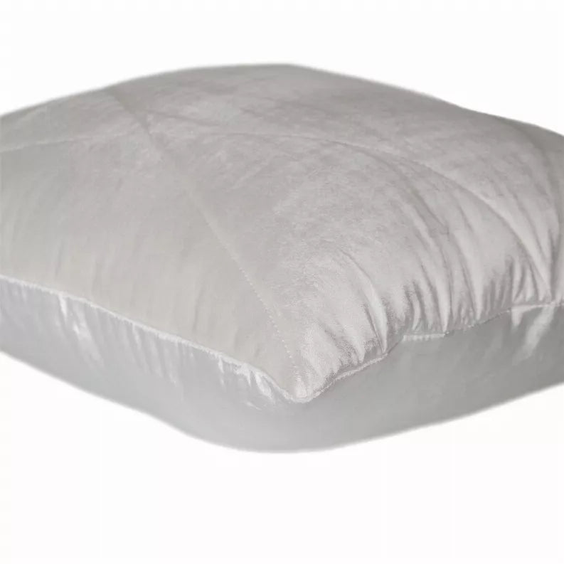 Light gray quilted throw pillow corner view with smooth fabric and stitched edges