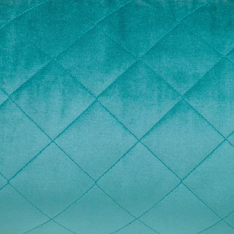 Turquoise quilted throw pillow front with diamond stitch pattern across the fabric.