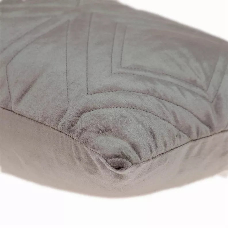 Light taupe quilted throw pillow close-up with stitched chevron pattern