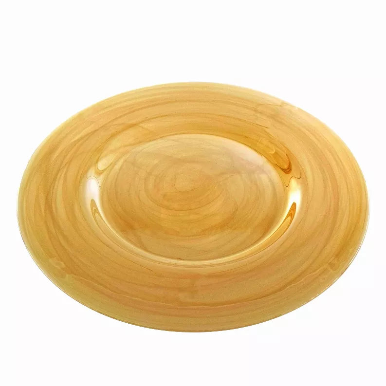 Amber yellow glass charger plate with glossy finish and smooth oval center