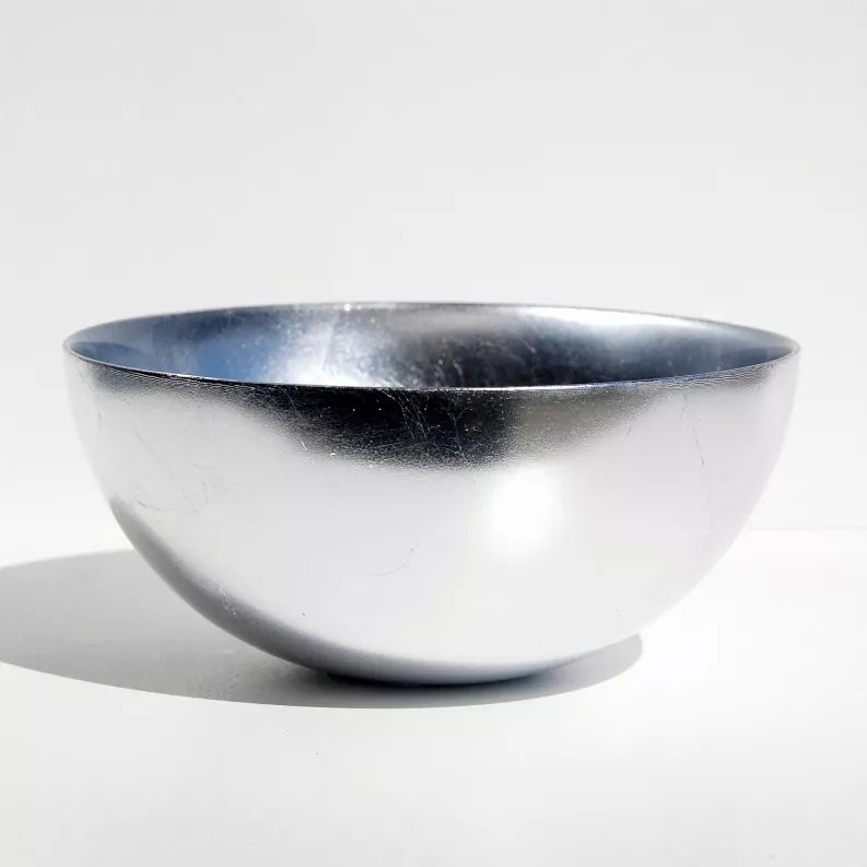 Silver glass serve bowl with dark blue rim and rounded sides