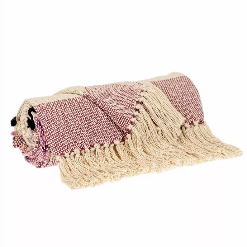 Woven beige and mauve throw with corner pom tassels and cream fringed trim