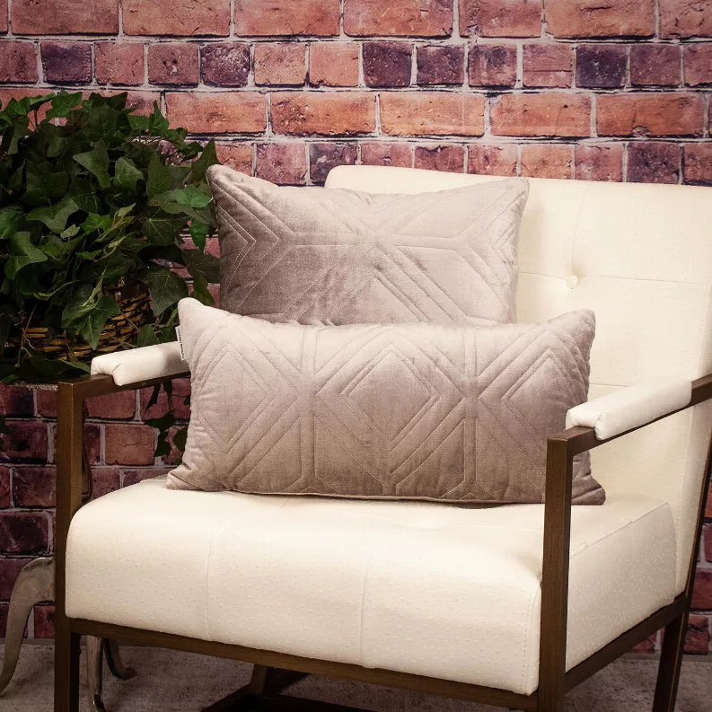 Beige quilted throw pillow with diamond-pattern stitching on the front