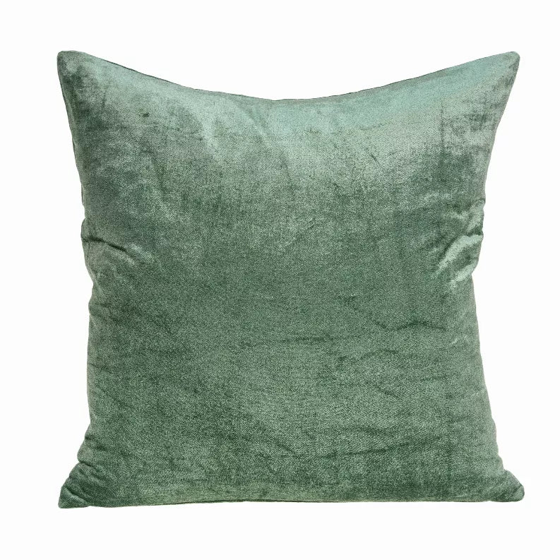 Green solid square throw pillow with textured surface and stitched border