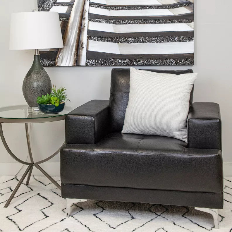 Square throw pillow with light cream cover and thin vertical dark stripes