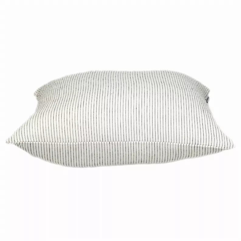 Square throw pillow with light cream cover and thin vertical dark stripes, flat view