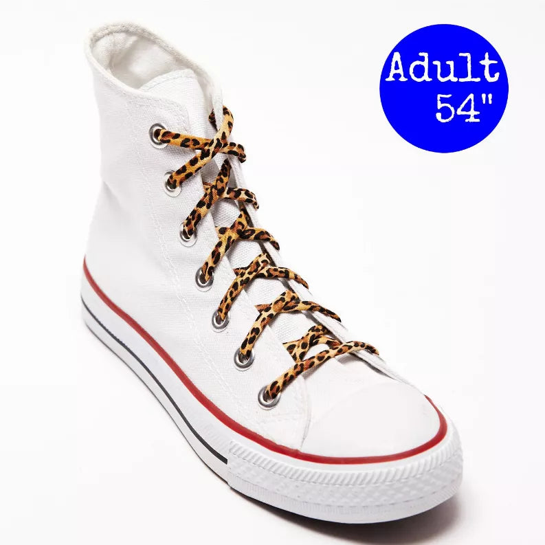 Animal-print shoelaces on white high-top sneakers with leopard-pattern woven laces