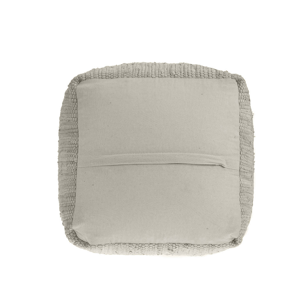 Neutral beige square cushion with a textured border, crafted from soft cotton fabric for cozy decoration.