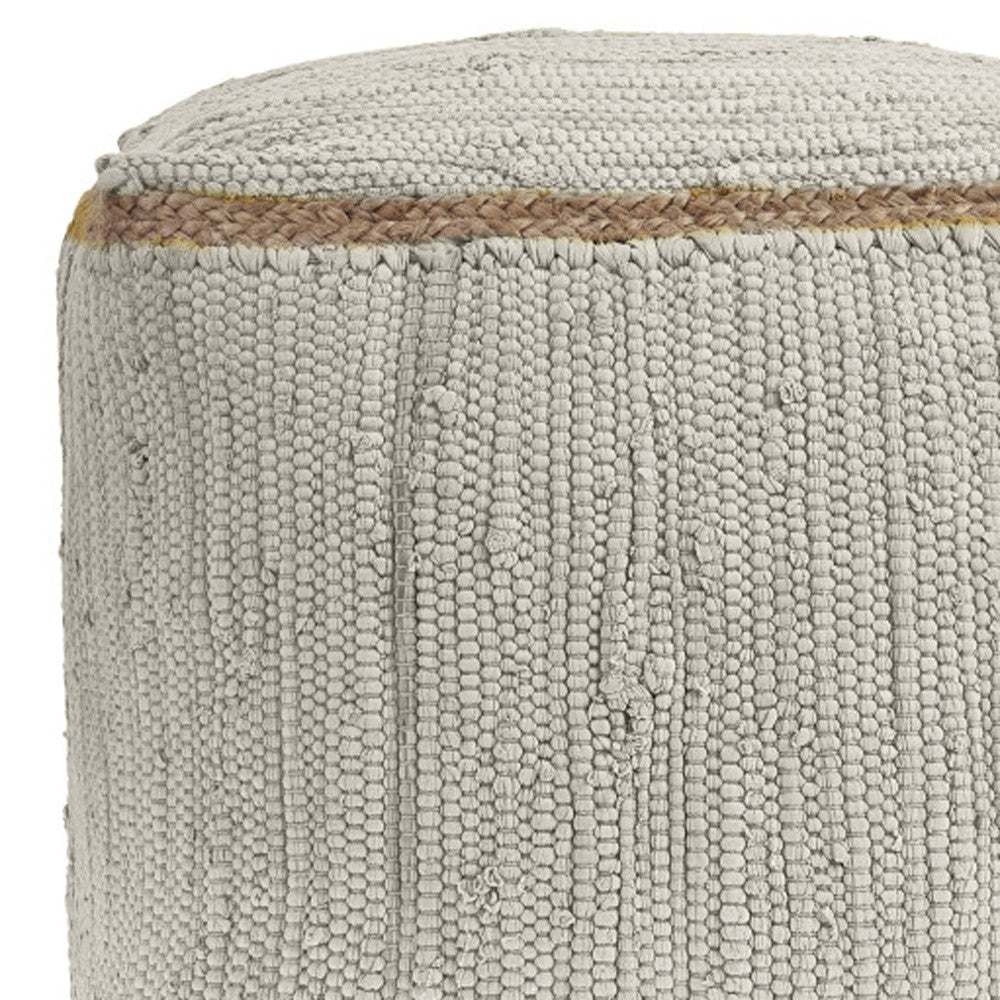 Gray woven pouf with natural jute accent, adding a textured, bohemian touch to any space.