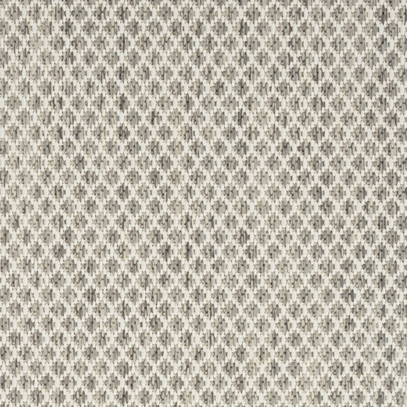 Textured close-up of ivory and silver diamond pattern rug, tightly woven look