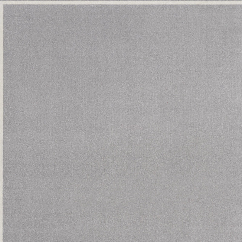 Indoor/outdoor area rug with solid grey surface and subtle texture, no border detail.