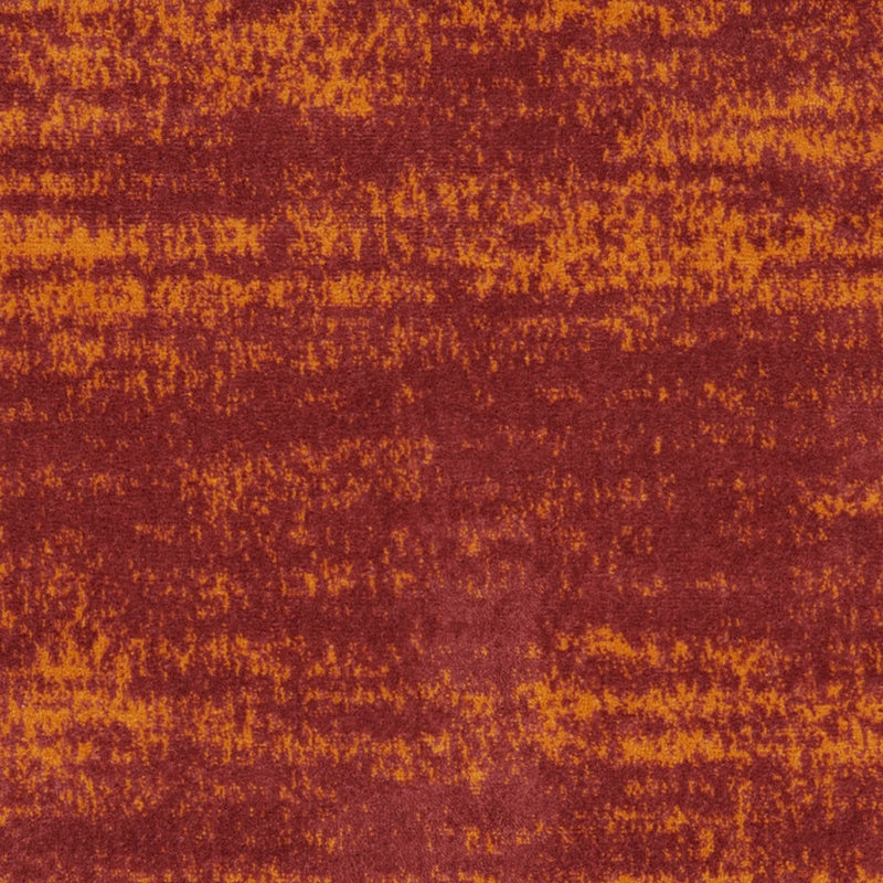 Area rug texture close-up in red-brown and orange with abstract mottling