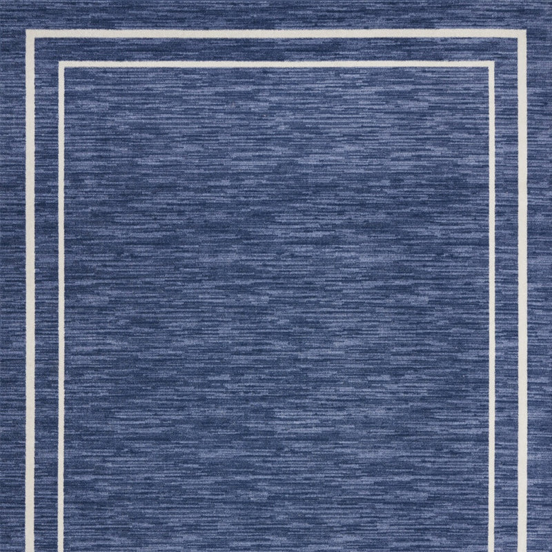 Navy and ivory area rug, centered square framed by thin ivory border lines
