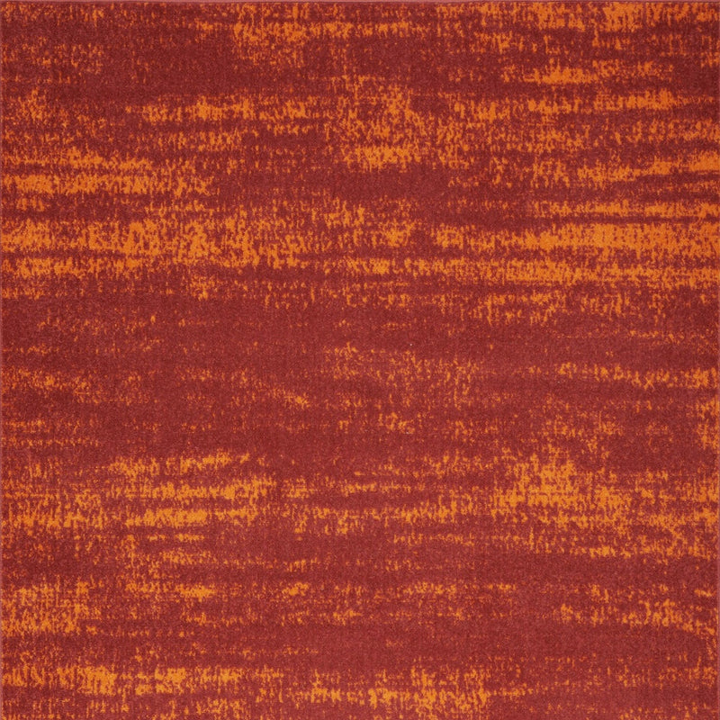 Red and orange abstract area rug with textured horizontal streaks