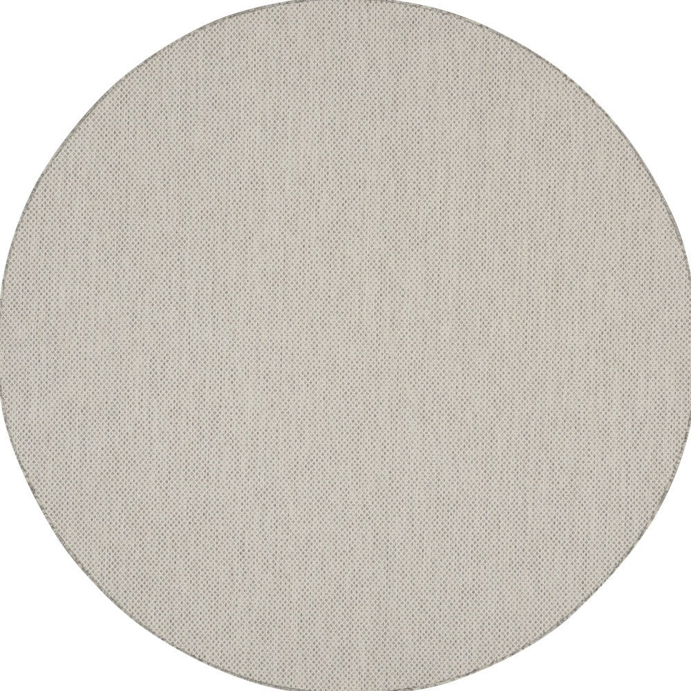 Round woven area rug with light ivory speckled pattern, 6 ft diameter