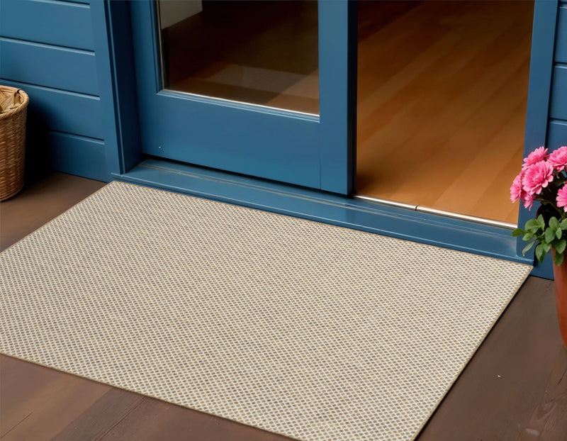 2 ft x 3 ft ivory geometric indoor/outdoor area rug with textured pattern