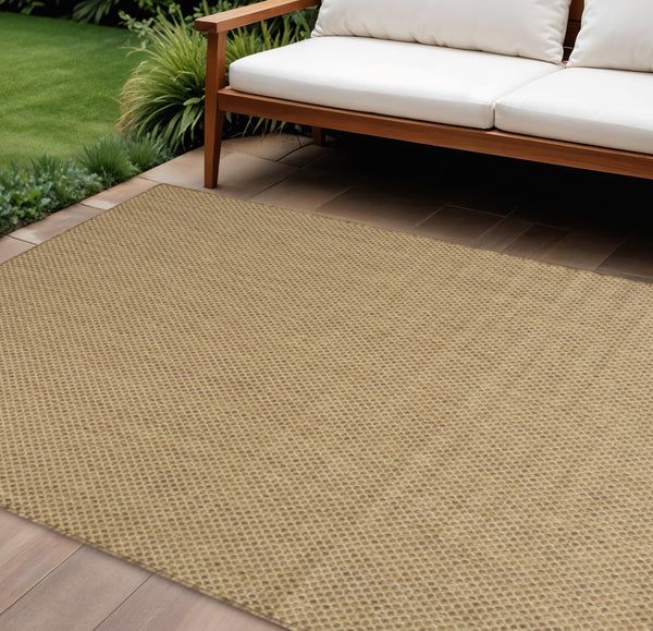 Tan geometric indoor outdoor area rug with low-pile woven texture