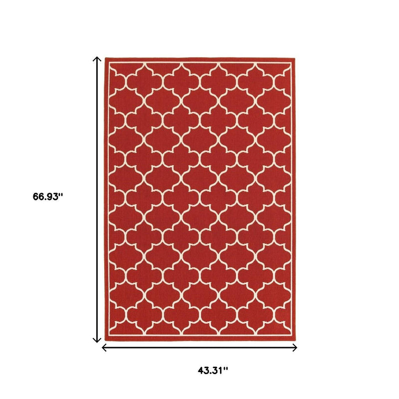 Rectangular rug design with red field and ivory quatrefoil trellis pattern