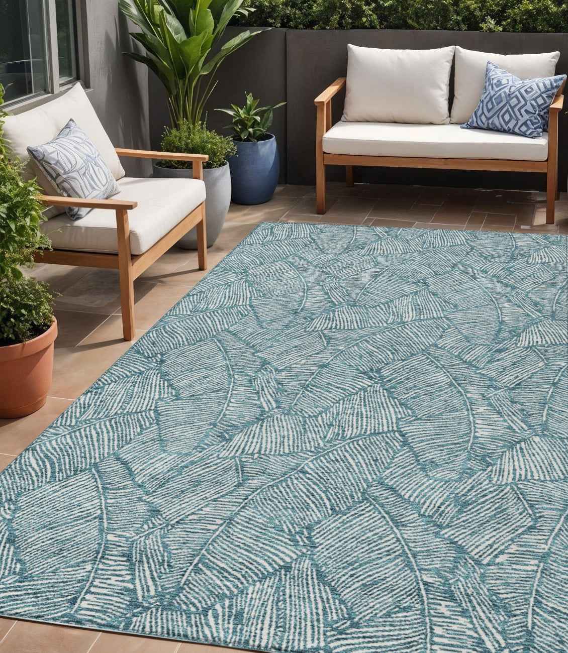 5' X 8' Teal Blue And Ivory Floral Washable Indoor Outdoor Area Rug